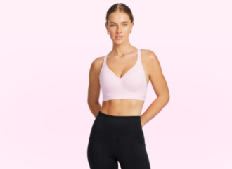 Female model in baby pink sports bra