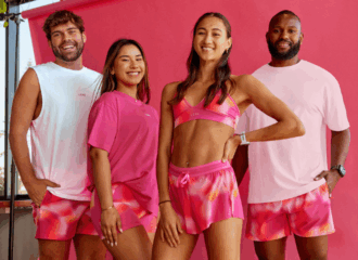 Image of two men and two women in pink activewear