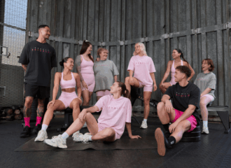 A group photo of men and women in the muscle republic breast cancer collection