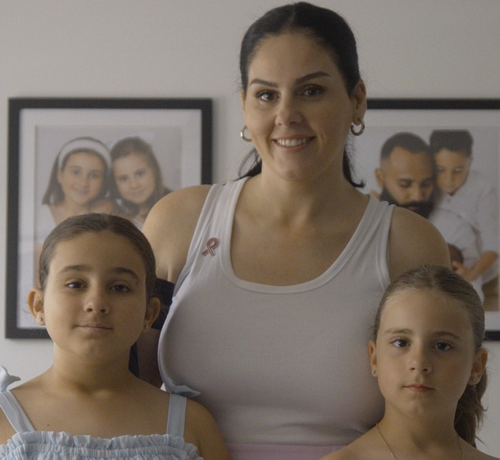 A photo of a mother and her two daughters