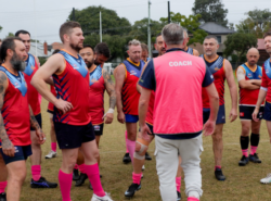 Photo of a group of men playing football