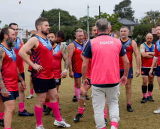 Photo of a group of men playing football